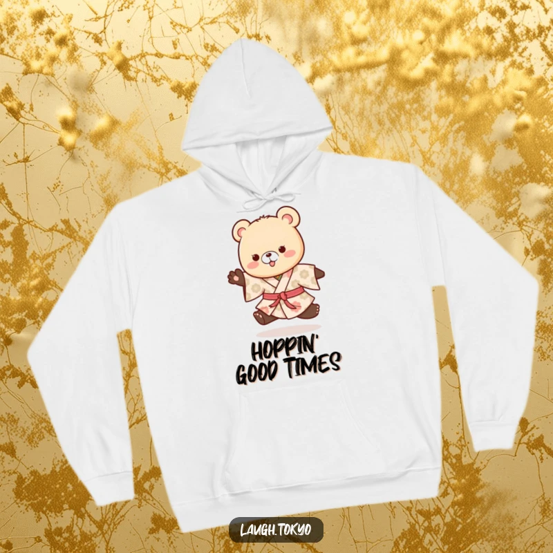 Funny playful bear cub in a patterned kimono doing a happy hop, printed on a warm and cozy hoodie.